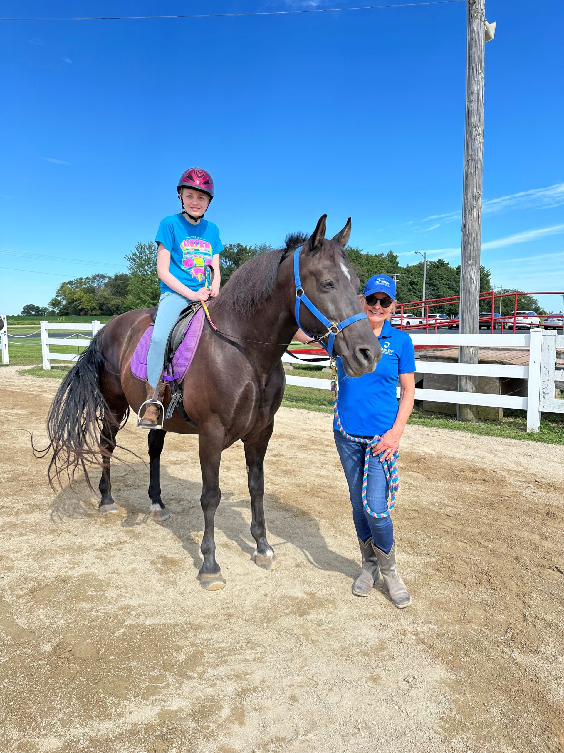 student riding horse