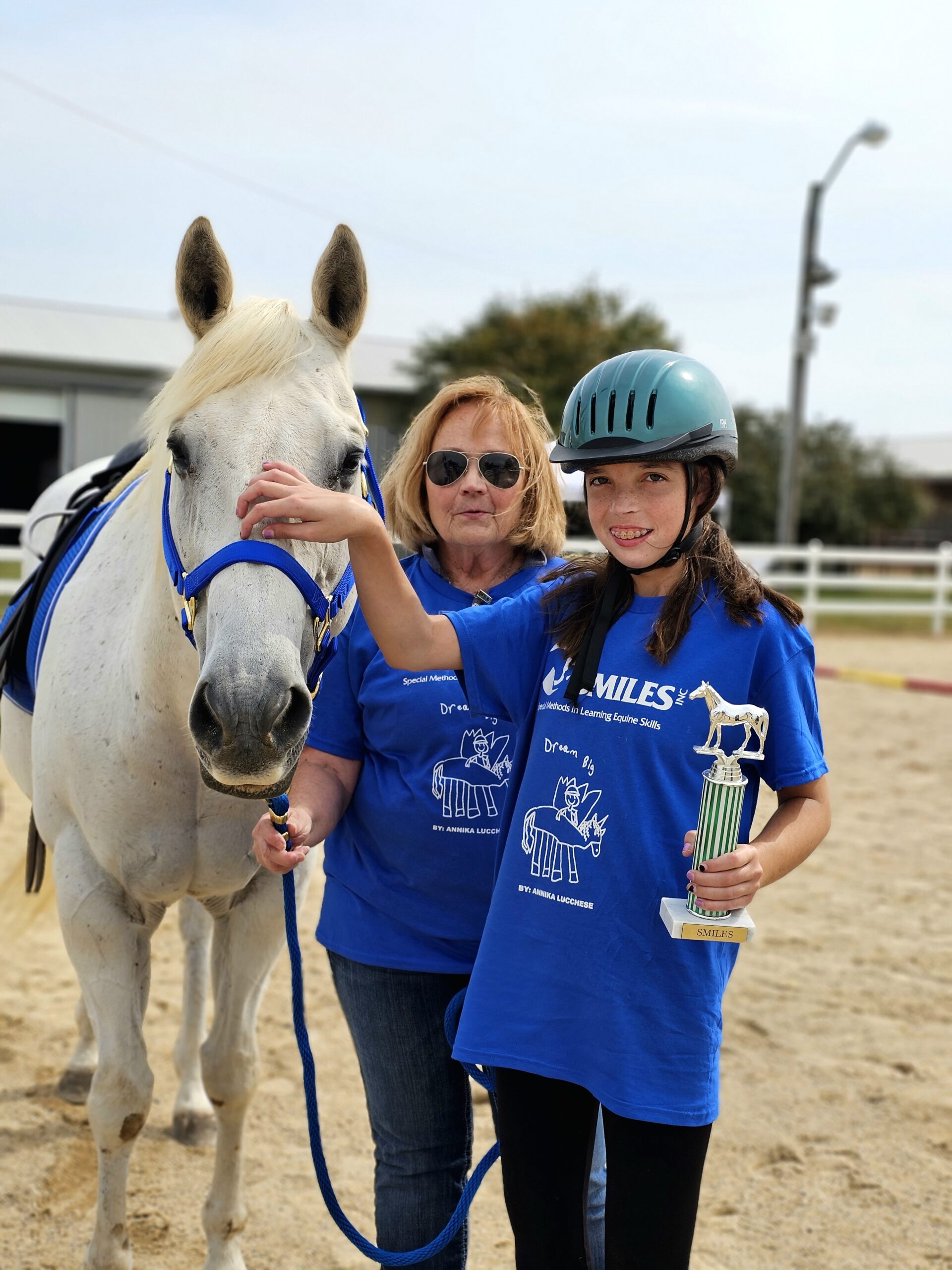 person petting horse