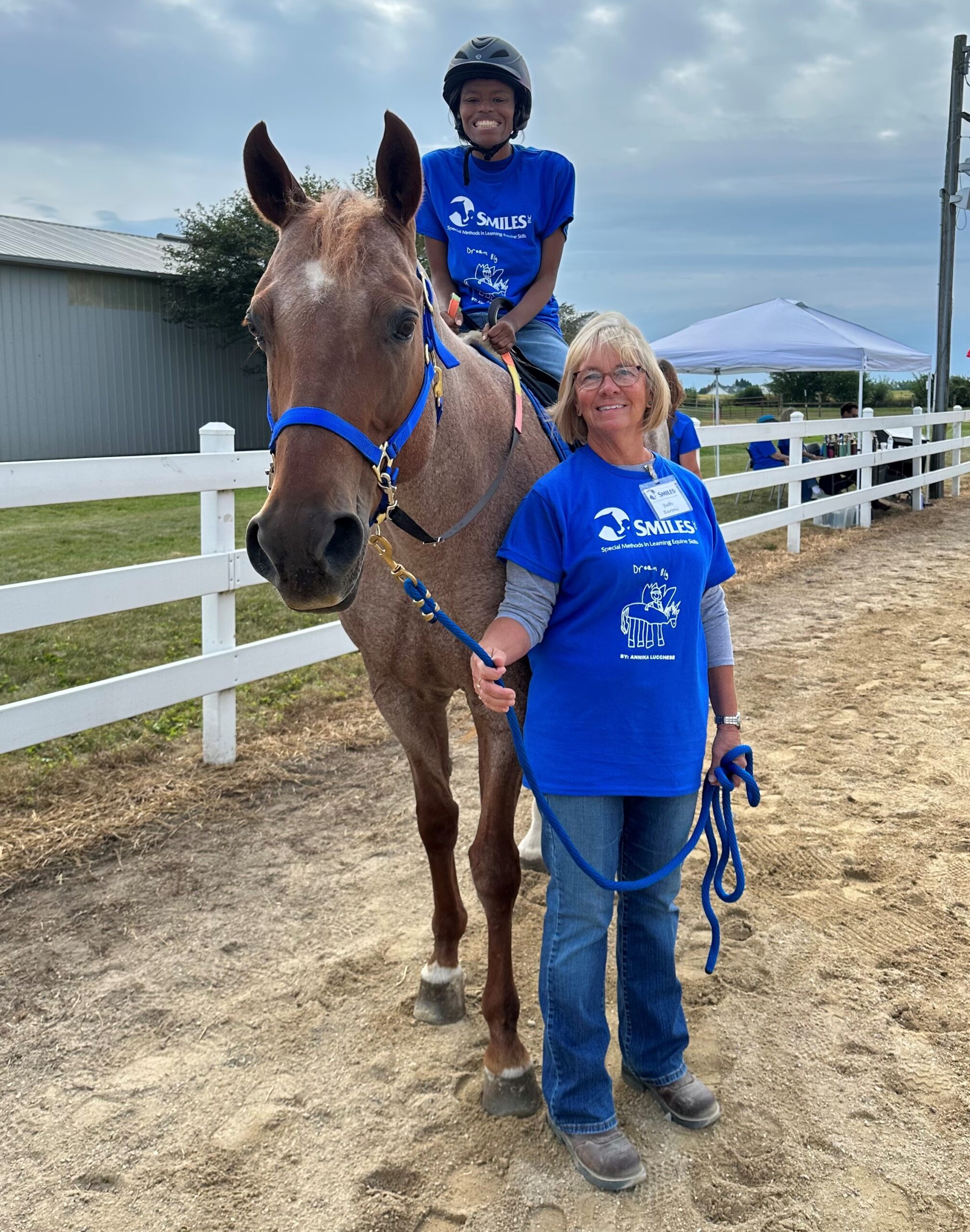 student riding horse