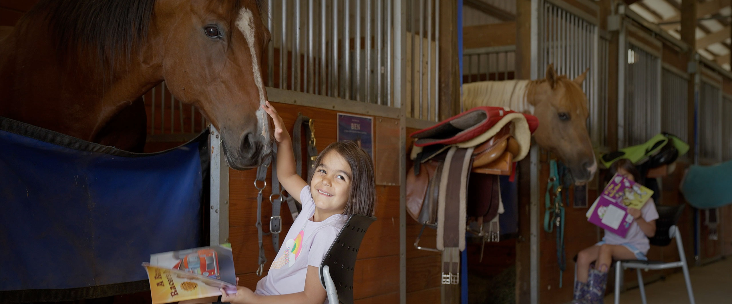 girl petting horse
