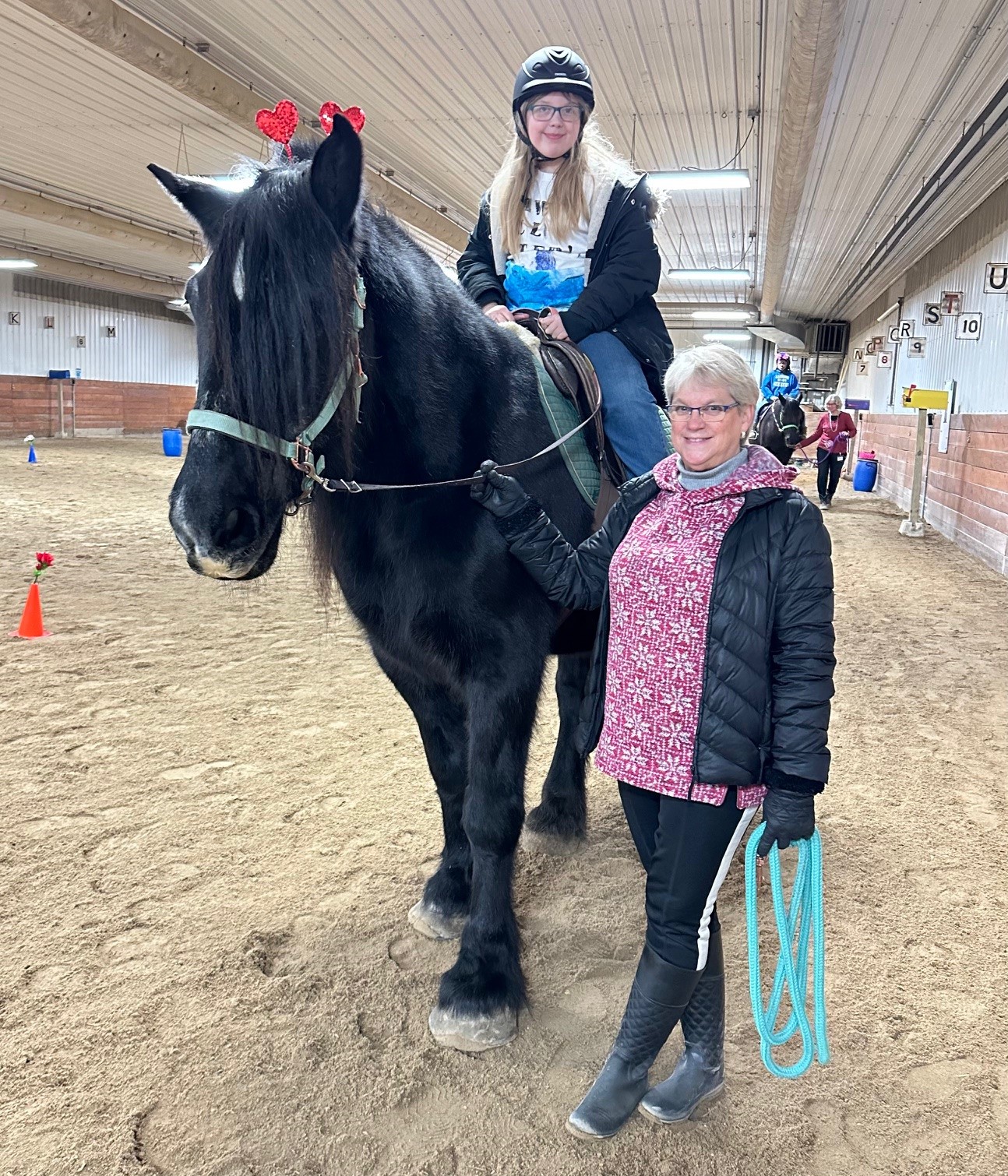 student riding horse