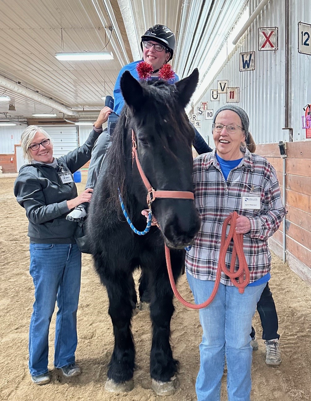 student riding horse