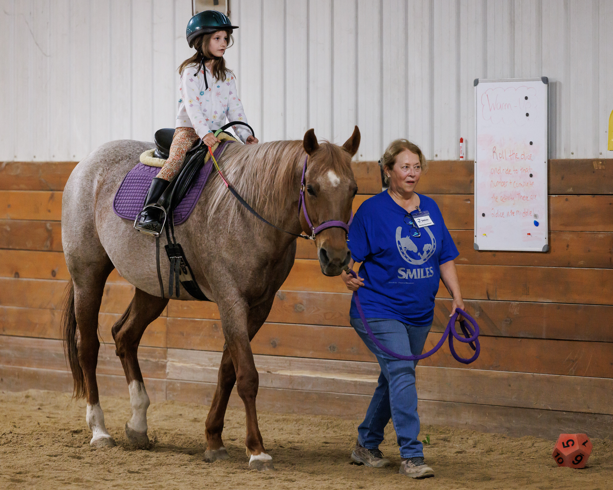 student riding horse