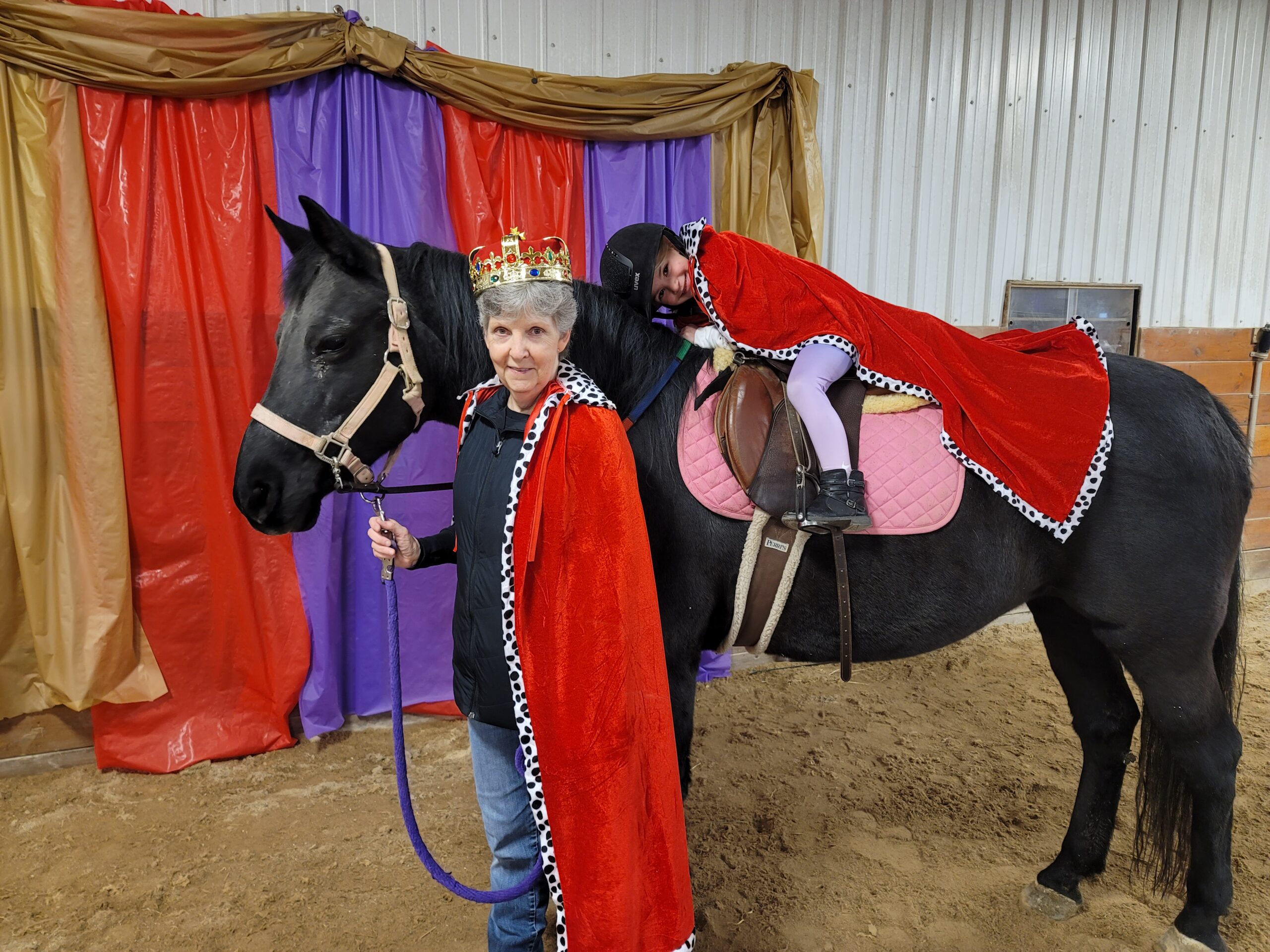 child in costume on horse