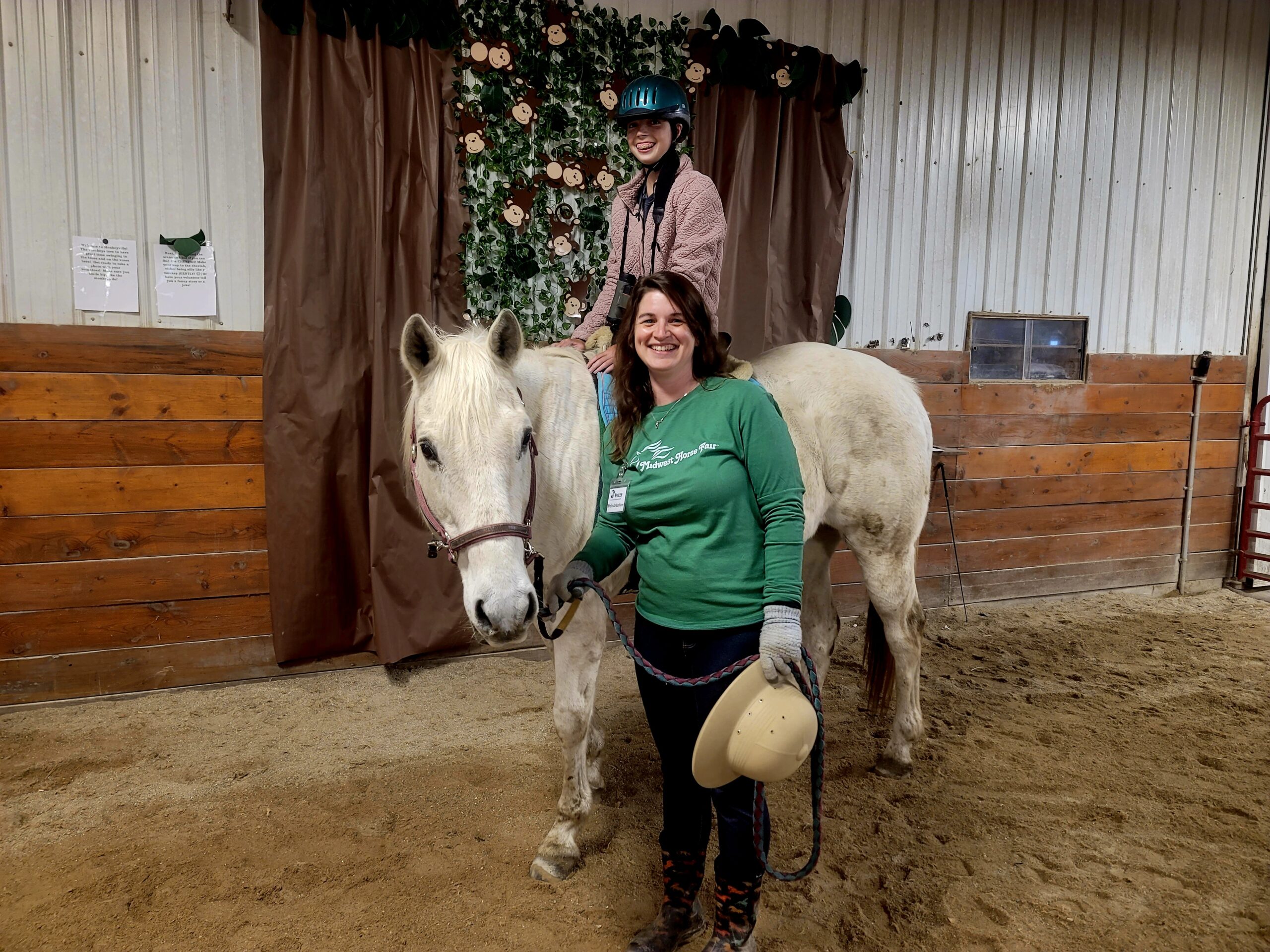 woman standing with horse