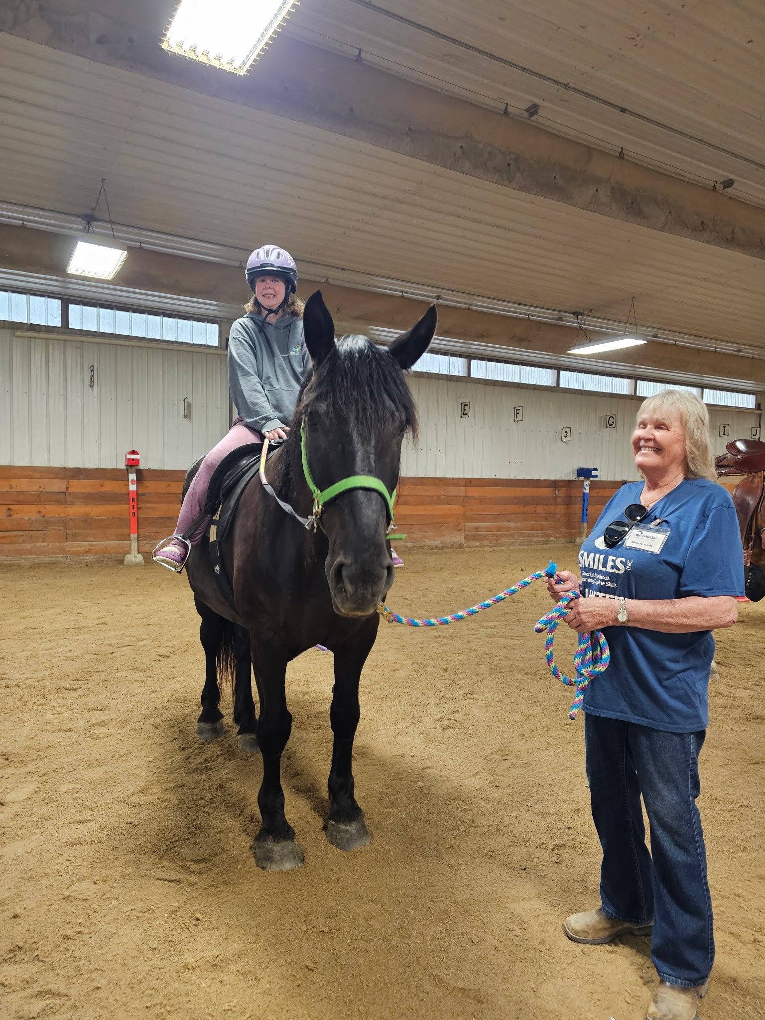 student riding horse