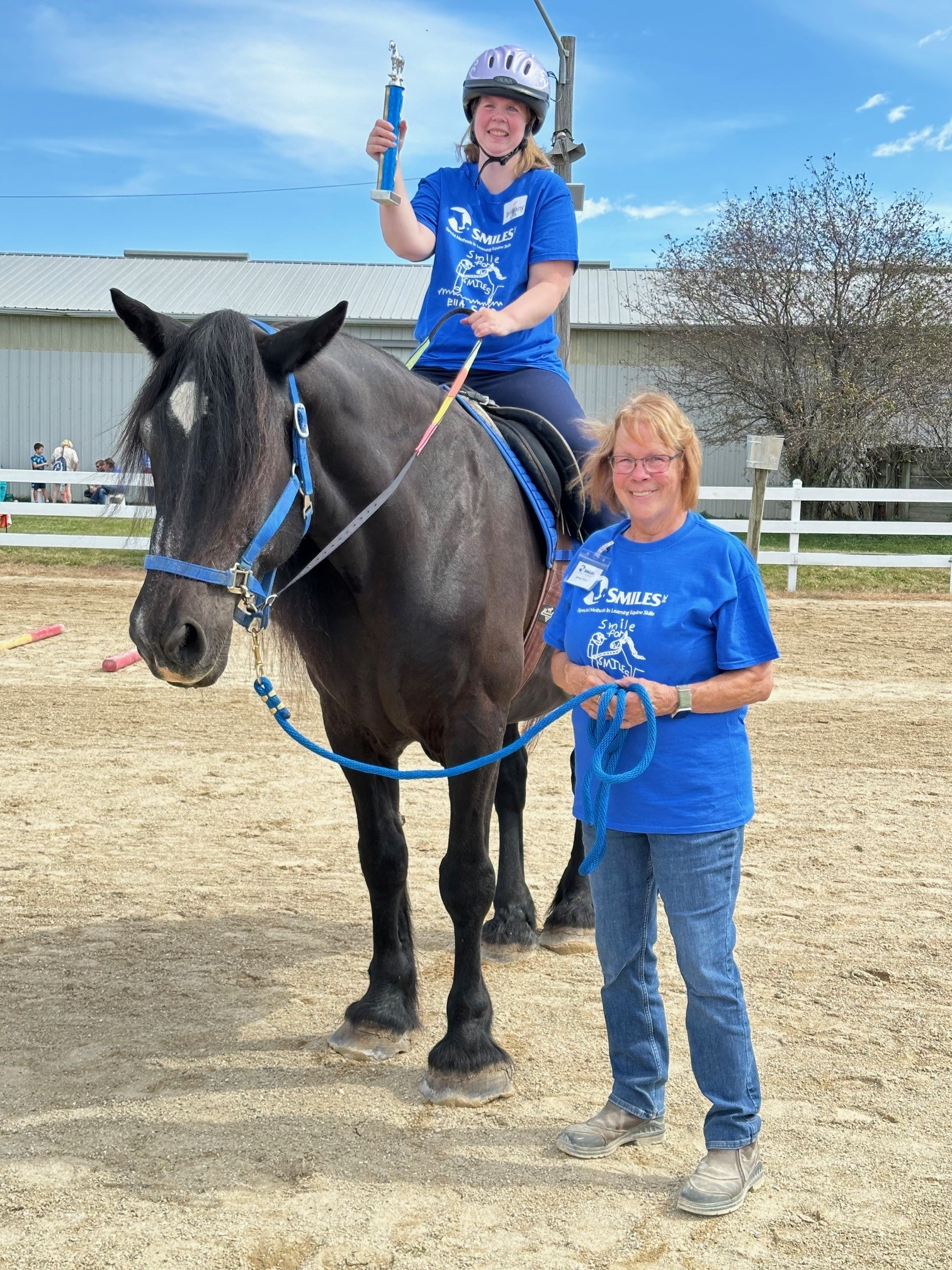 student riding horse